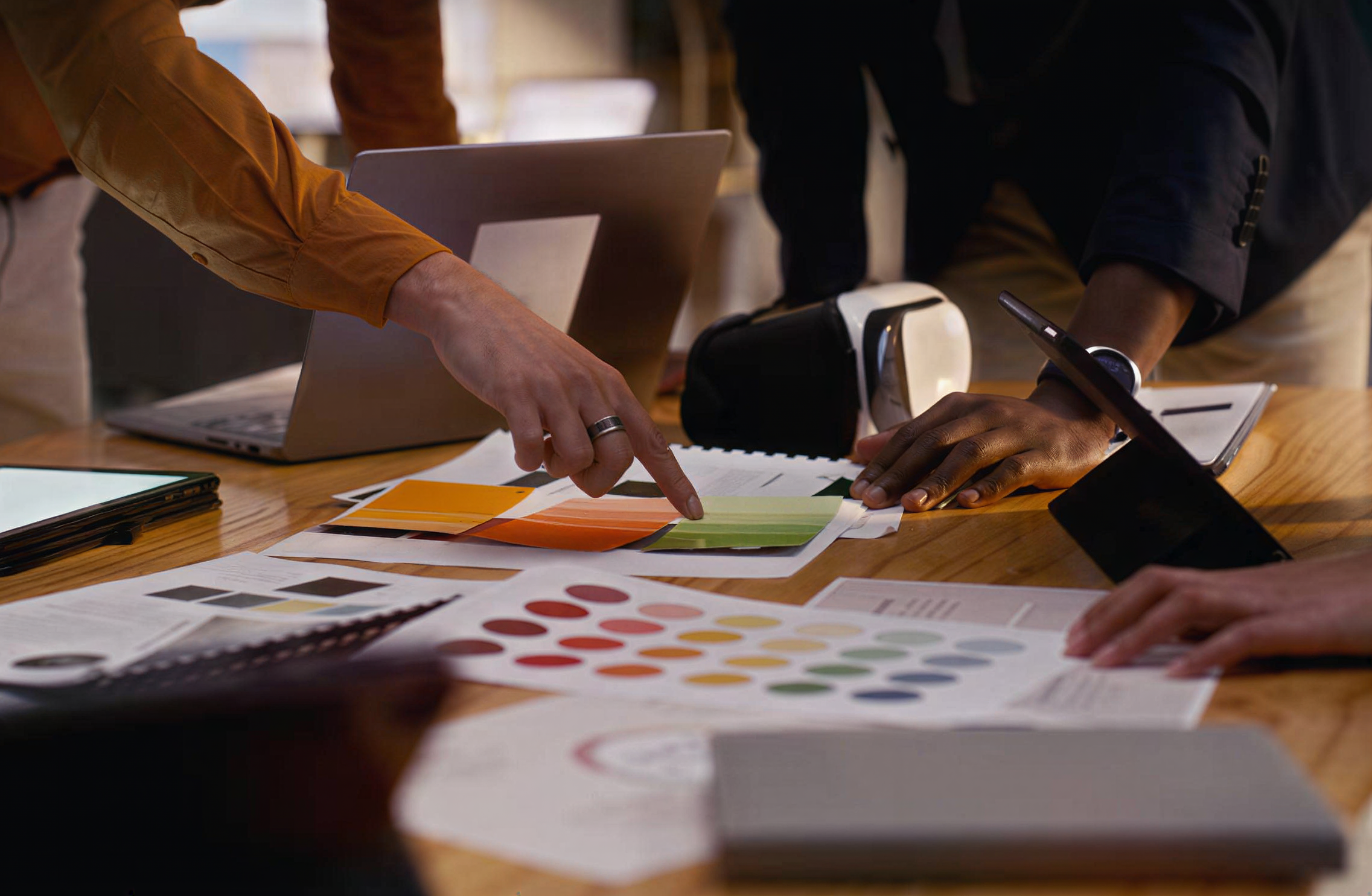 Team reviewing campaign designs and color samples